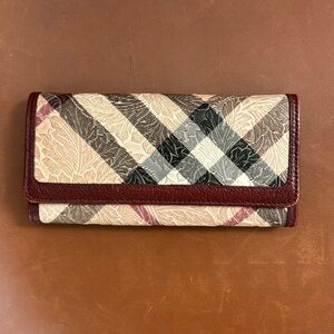 Burberry Continental Flap Wallet. Leather with beautiful raised details.